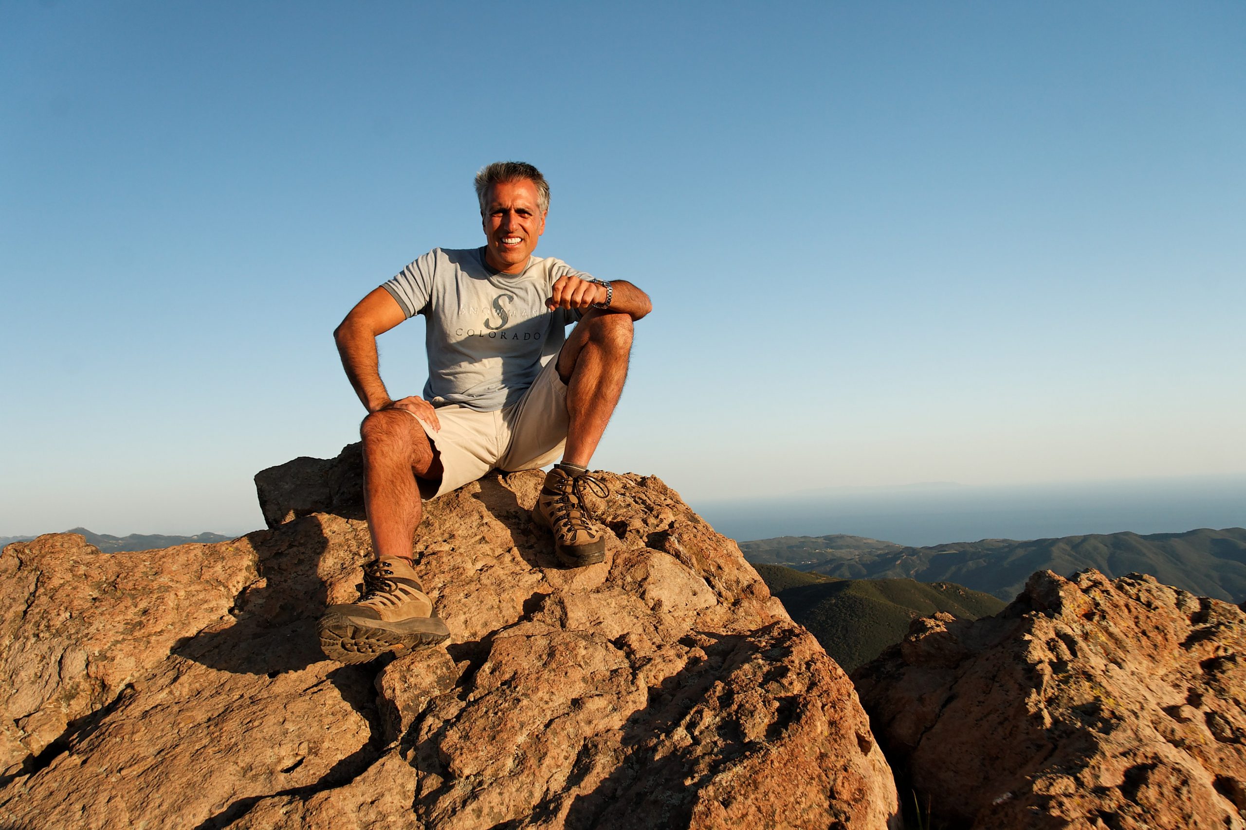 Erol Fox outdoors on a mountain ridge
